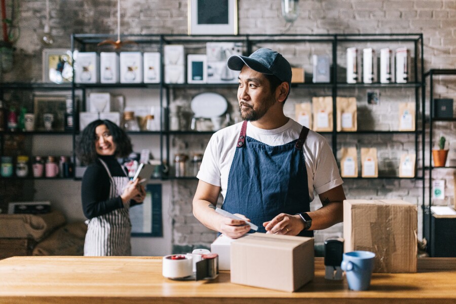 A dynamic scene unfolds in the office as a multiethnic team of business professionals collaborates, reflecting the strength and creativity that comes from diversity.